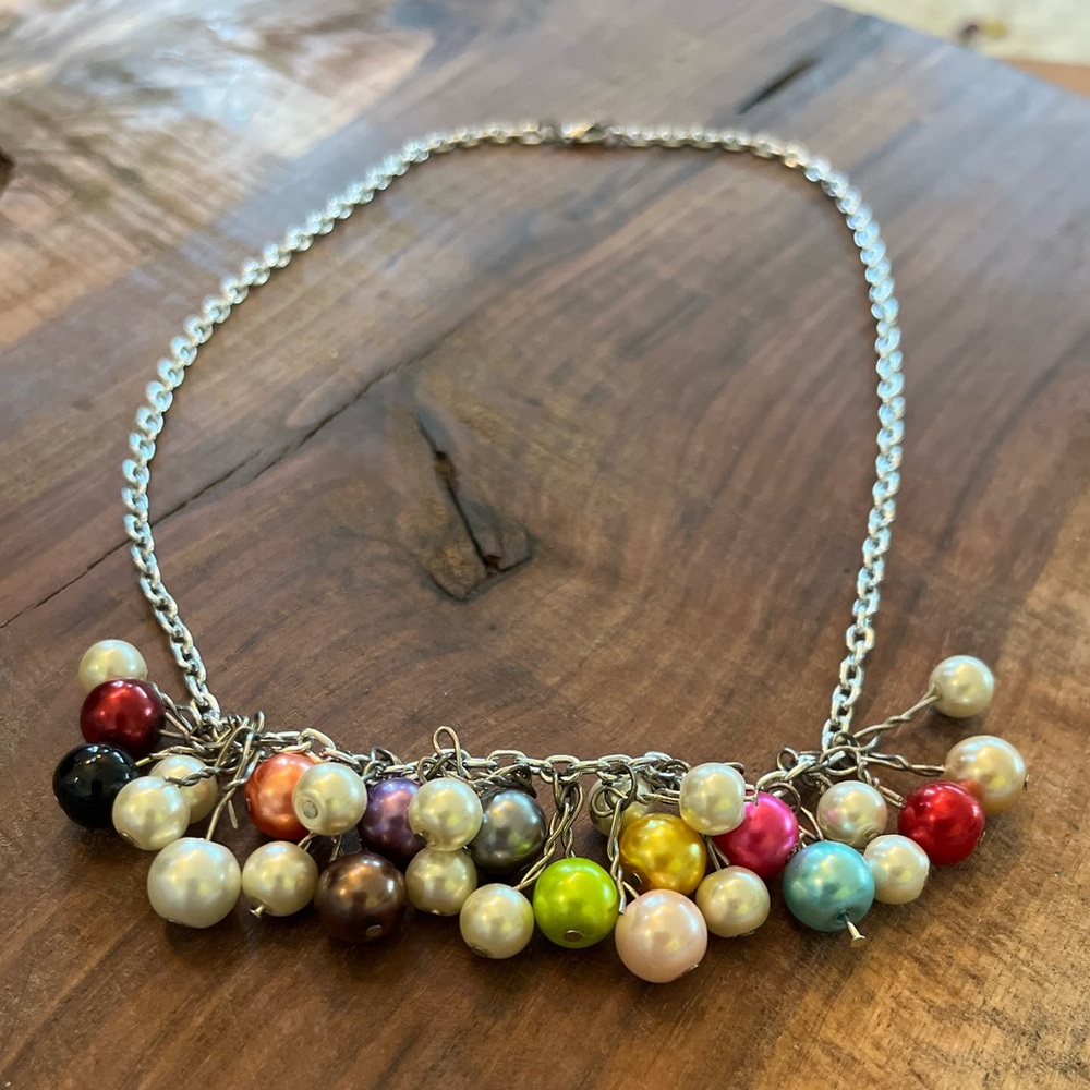Handmade necklace. Colorful beads. Owned for a few years and has not tarnished.